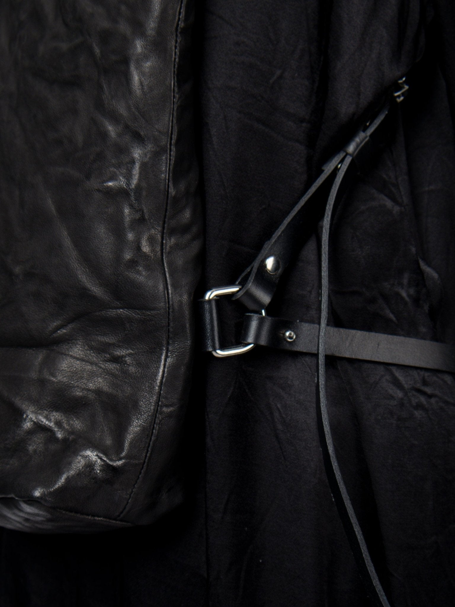 NOAM Oyster Backpack, side strap hardware detail view