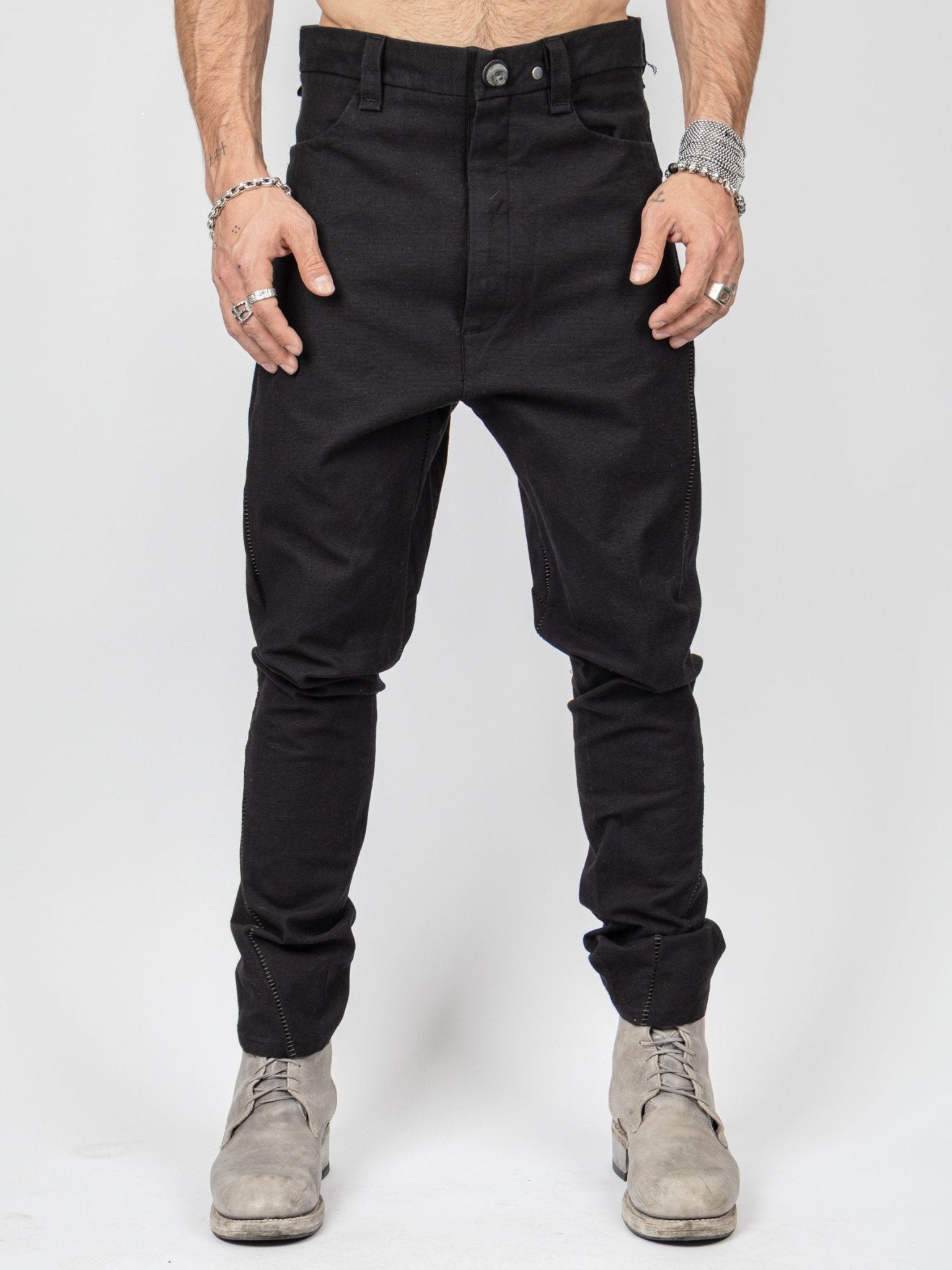 Isaac Sellam armure cotton pants front view - drop-crotch silhouette and leather trim detail
