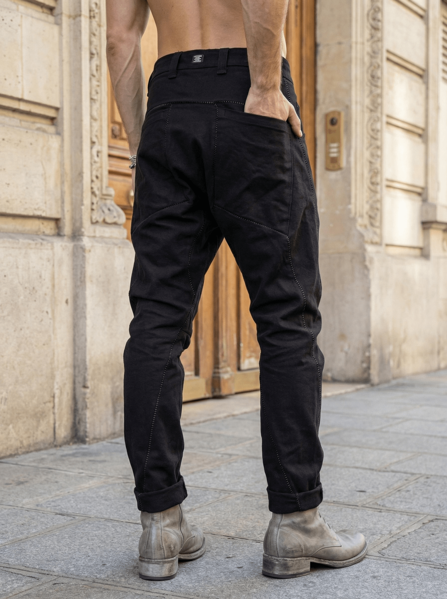 Isaac Sellam LC4 signature staple - close-up of gunmetal marking on garment-dyed cotton