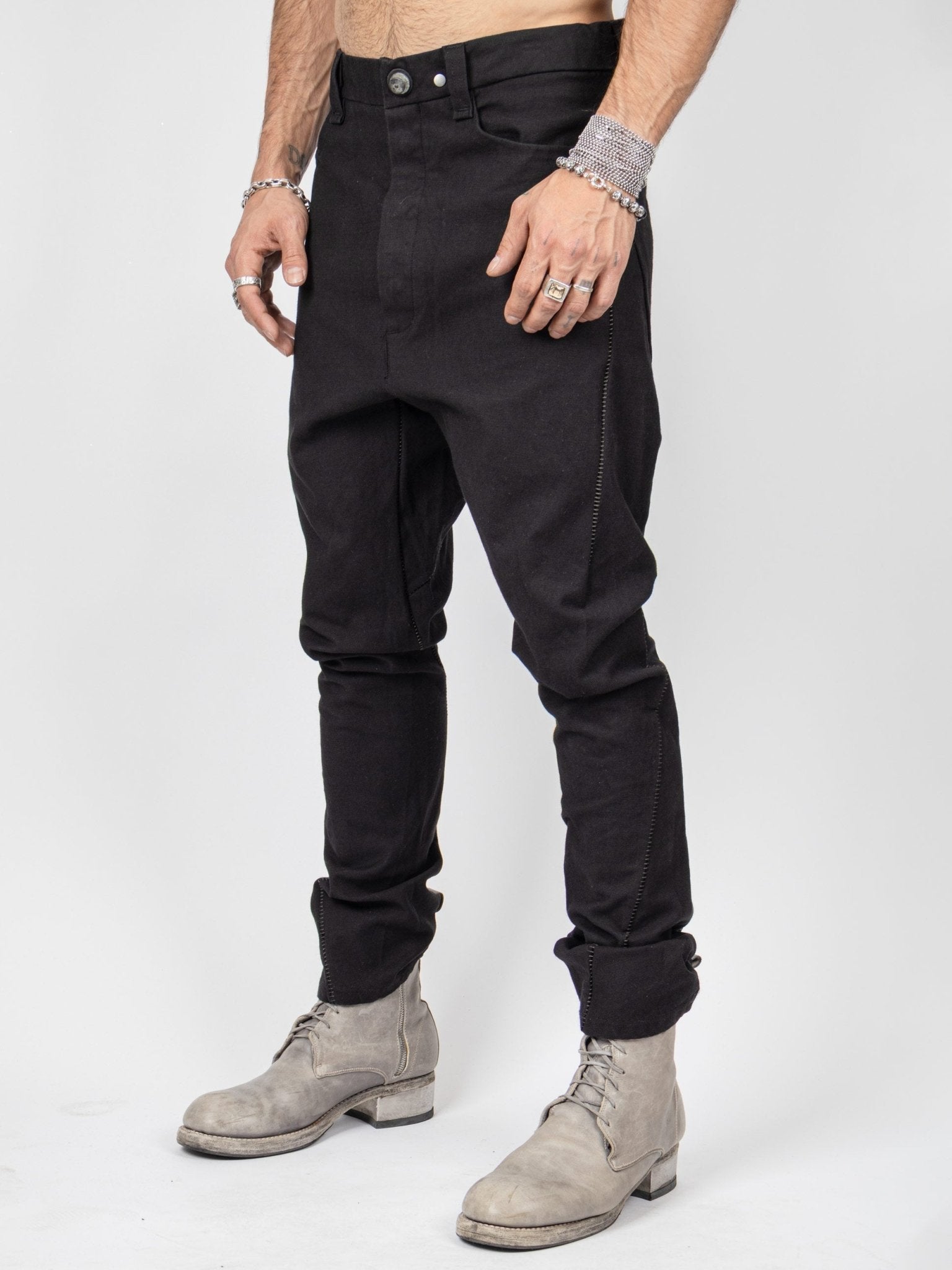 Isaac Sellam LC4 pants 3/4 front view - relaxed drop-crotch cut with four-pocket detail
