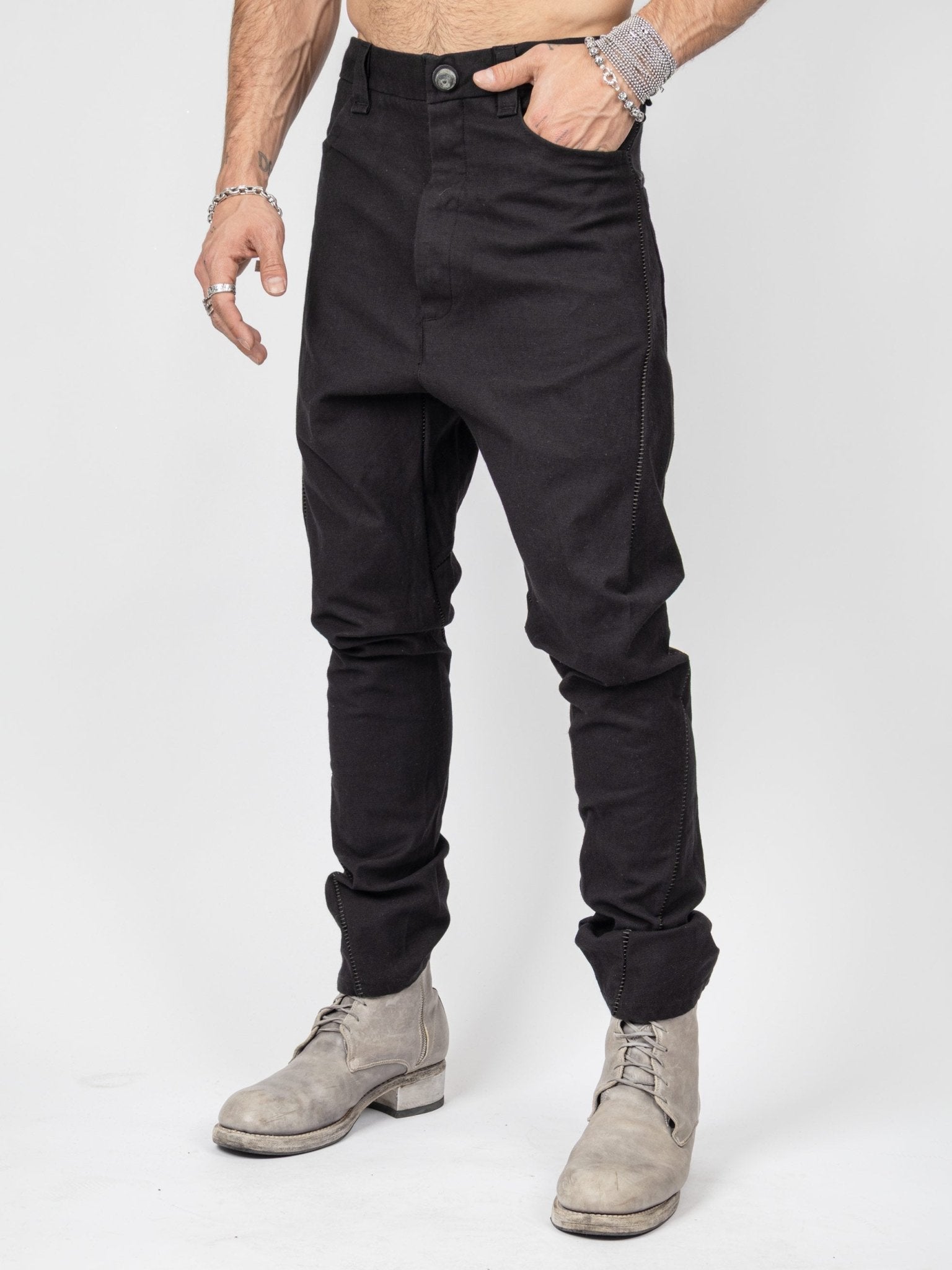 Isaac Sellam armure pants three-quarter view - leather trim contrast at pocket edges