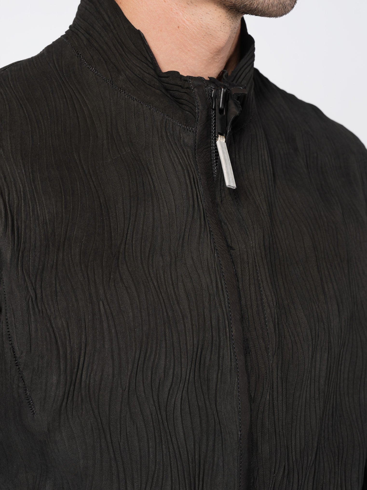 ISAAC SELLAM Wavy Pleated Leather Spine Jacket, front collar and zipper detail close-up