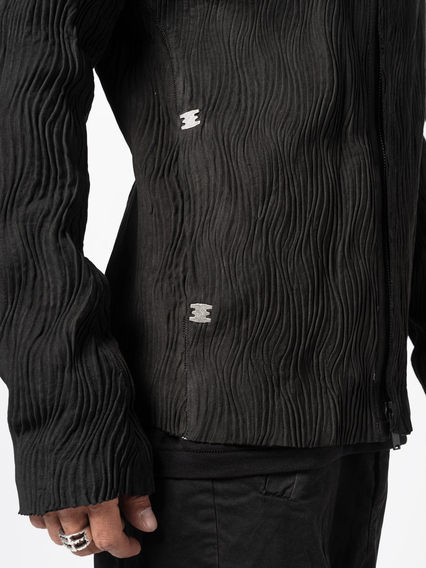 ISAAC SELLAM Wavy Pleated Leather Spine Jacket, side hem and sleeve detail view