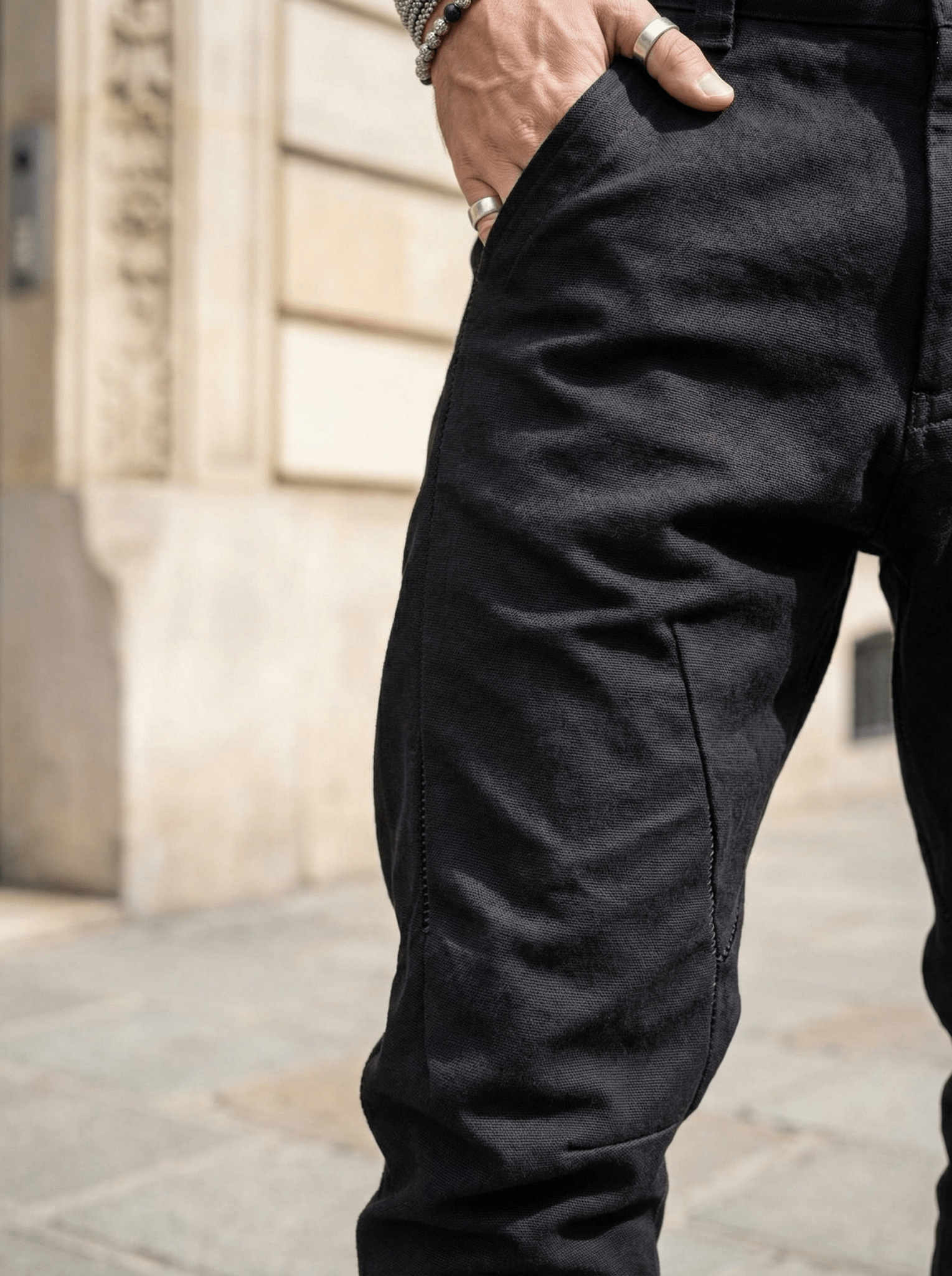 Armure weave pants detail - leather trim contrast showing cold-dye color absorption at seams
